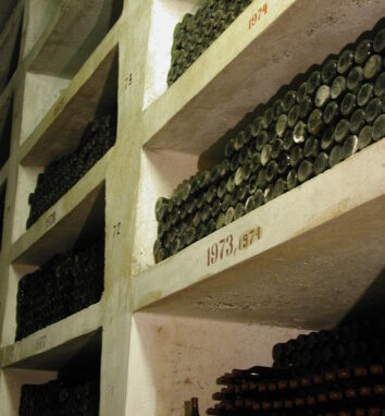 Alcoves in the Ialoveni collection cellar stacked with dusty bottles marked 1973 and 1974